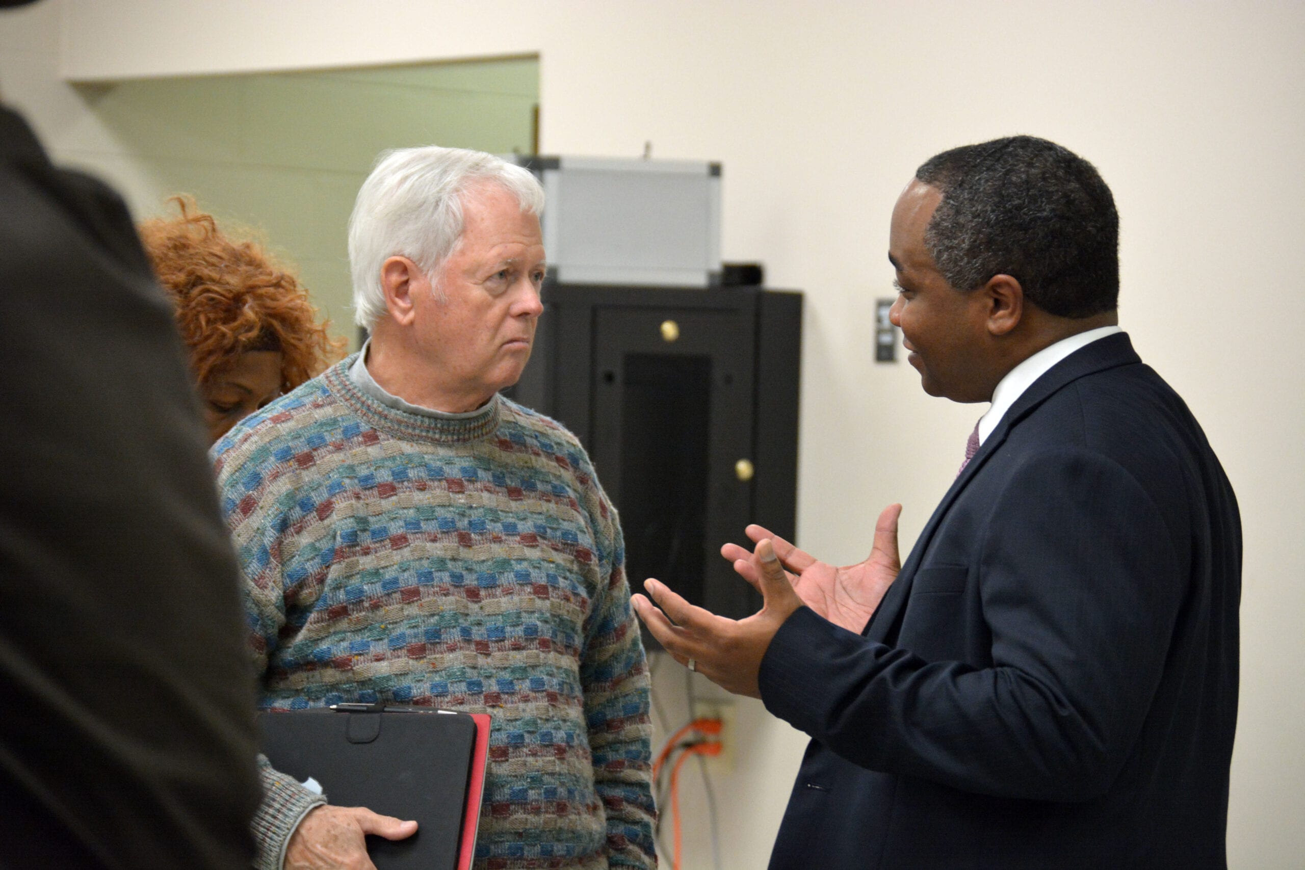 DA Merriweather speaking with a citizen